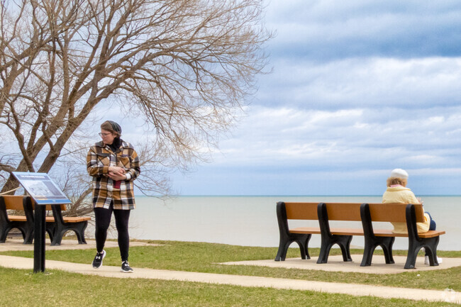 Enjoy a serene view of Lake Michigan from a bench at the tip of Wind Point.