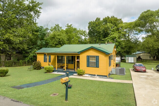 Well-kept lawns and mature trees frame homes in Lipscomb’s residential areas.