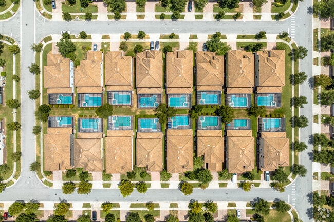Many residents in Champions Gate beat the heat in their enclosed pools.