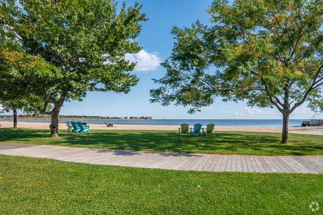 Serene beachside park located at Jacob's Beach in Guilford overlooking a tranquil sandy beach.