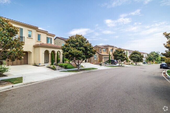 Many homes feature classic Spanish-style designs such as arches and terracotta roofs.