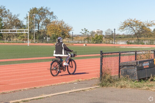 Some residents prefer to ride their bike on the running track.