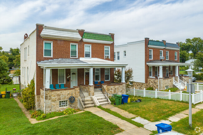 Escape the summer heat on your shaded porch in a brick duplex in Waltherson.
