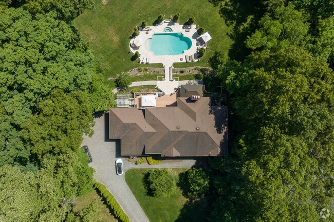 Some homes in Old Tappan feature private pools for summer fun and relaxation.