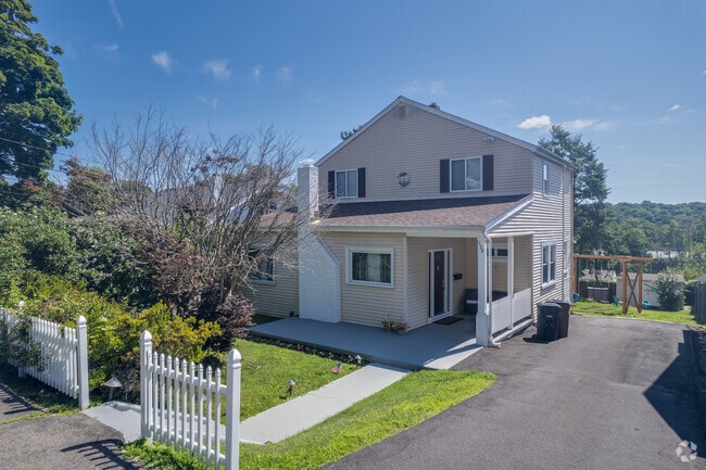 Modest Colonial style home located on Knickerbocker Avenue in Springdale.