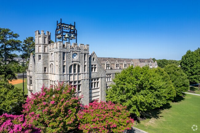 The iconic gothic architecture of Oglethorpe University defines the northern end of Peachtree Corridor and reflects its academic legacy since 1913.