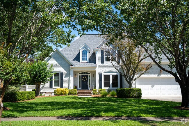 Some homes in the Tanglewood neighborhood have mature trees.