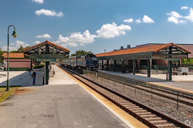 Commuters board Tri-Rail trains at Deerfield West station.
