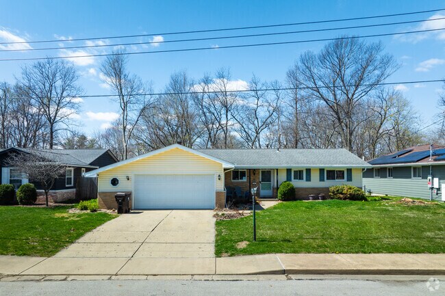 Some homes in Wardcliffe have gardenf lags and small lanterns lighting the sidewalk.