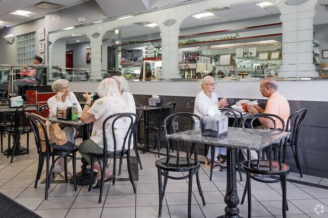 There is usually a lunch crowd at Arcos Pastry in Manor Section .