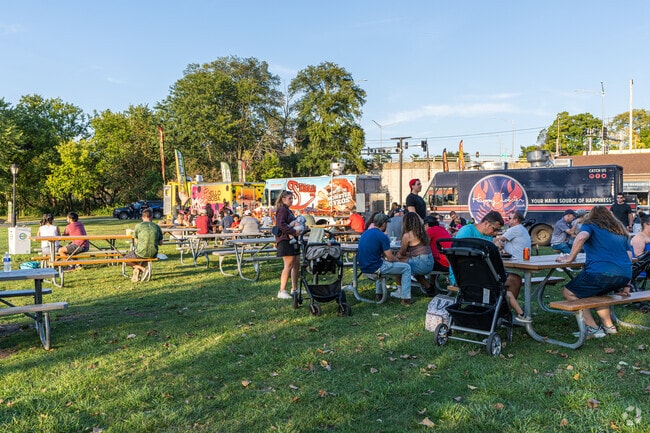 Residents can enjoy live music and food at Cuisine at the Crossroads near University Neighbors.