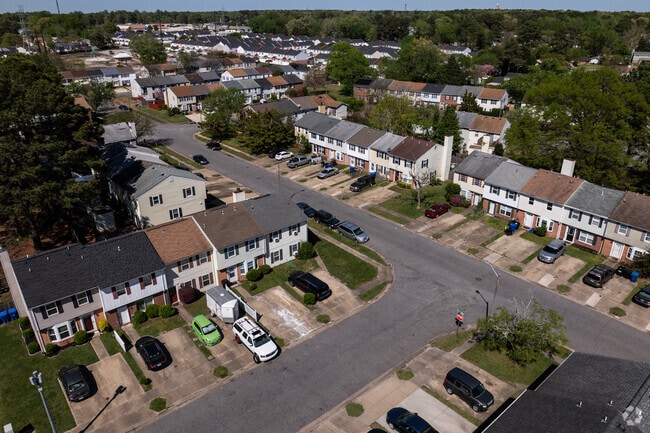 An aerial view shows rows of townhomes in the Level Green neighborhood.