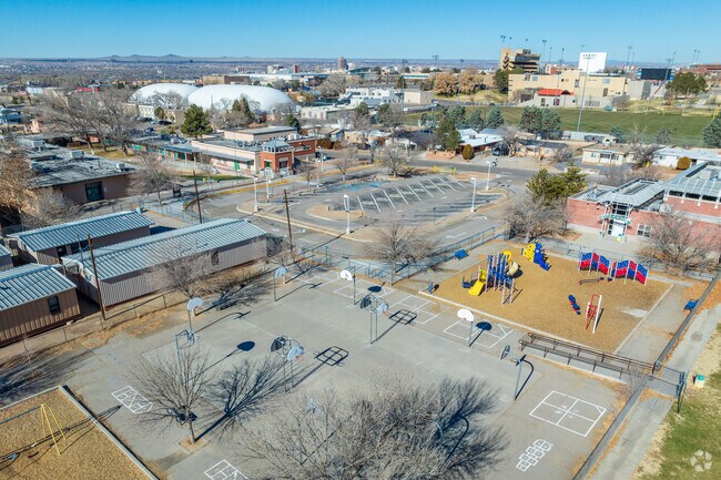 Lowell Elementary School and the UNM Lobo's football stadium in the background.