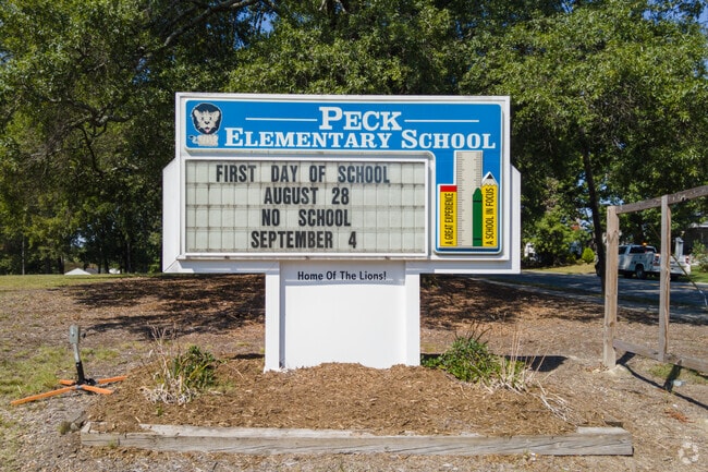 The plaque at the entrance of Clara J Peck Elementary School