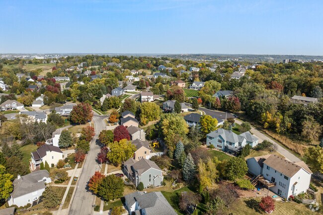 Tree-lined streets and spacious homes define the serene atmosphere of Foxcroft neighborhood.