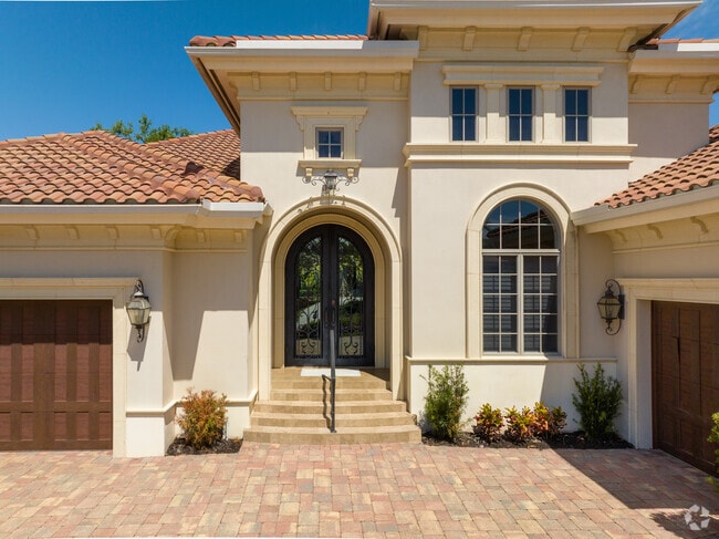 Custom ironwork accents this home in Park Shore, FL.