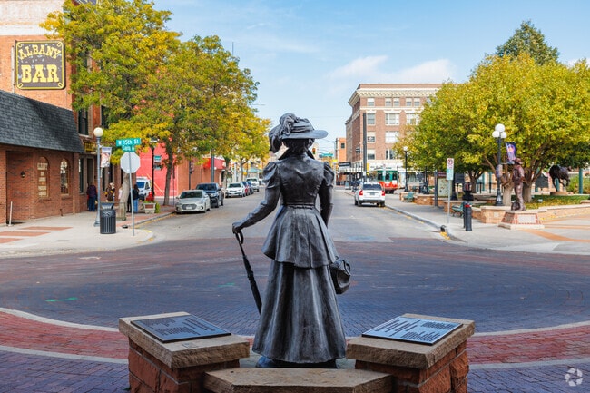 Bronze statues with tales of the city’s history tower above the streets of Historic Cheyenne.