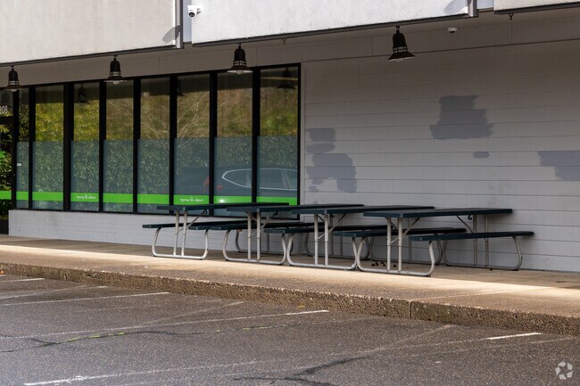 Picnic benches sit outside the campus for students to enjoy.