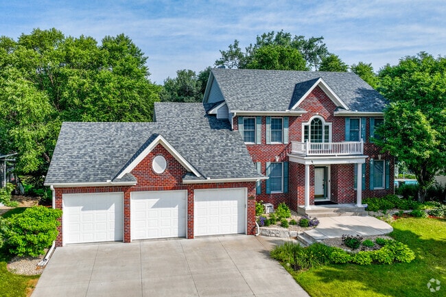 Beautiful colonial revival-style homes line the fairways of TPC Twin Cities in Blaine.