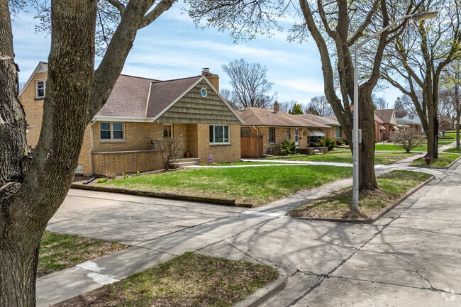 Large trees line the streets of the charming President Heights neighborhood.