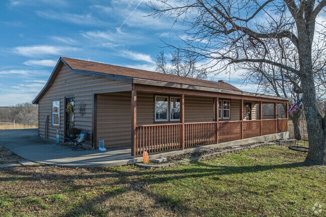 A ranch style log cabin is among the many unique homes in Sulphur Springs.