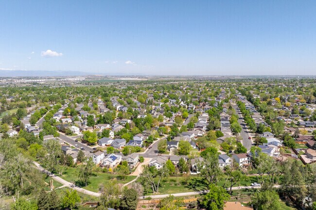 An aerial view of Signal Creek showcases its winding streets, well-spaced homes, and lush greenbelts that give this Thornton neighborhood its peaceful charm.