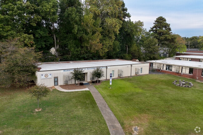 Marietta Center for Advanced Academics - Dethatched Part of School With Sign
