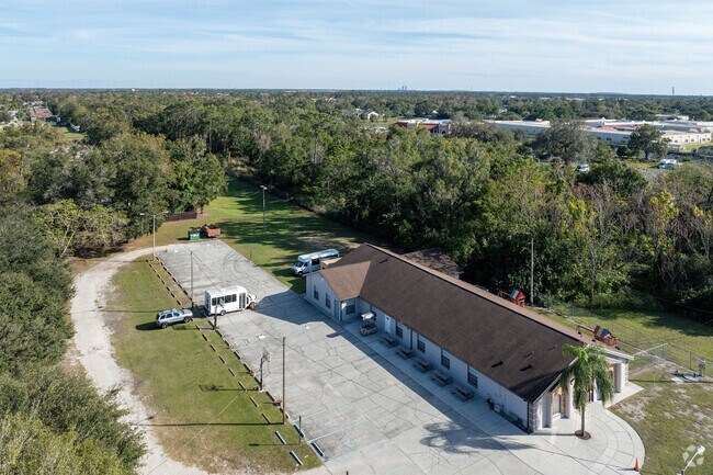 Mature trees ensure privacy on the south side of Generation of Hope Academy.