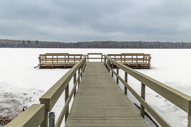 Locals enjoy the fishing pier at Carey Lake Park during the summer.