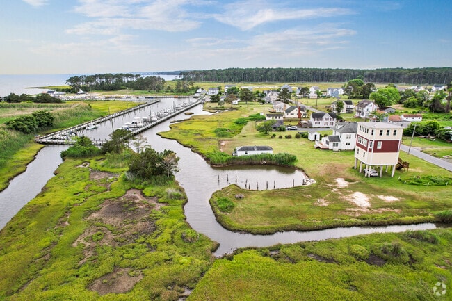 Greenbackville blends bay life with scenic charm, offering views of marshes, inlets, and open water beyond Captain’s Cove.