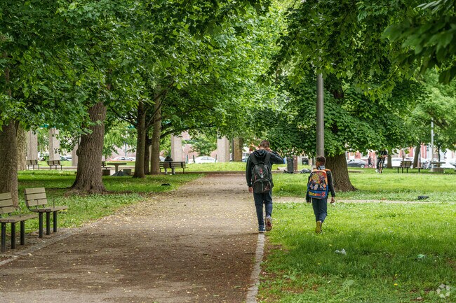 the paths at Fairhill Square Park serves as a handy shortcut for kids walking home from school.