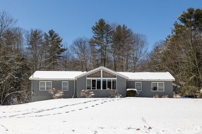 Large central windows in this home take advantage of the spectacular views of Greene.