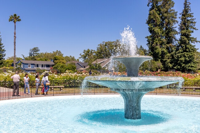 Water fountain surrounded by beautiful roses at the Municipal Rose Garden in San Jose.