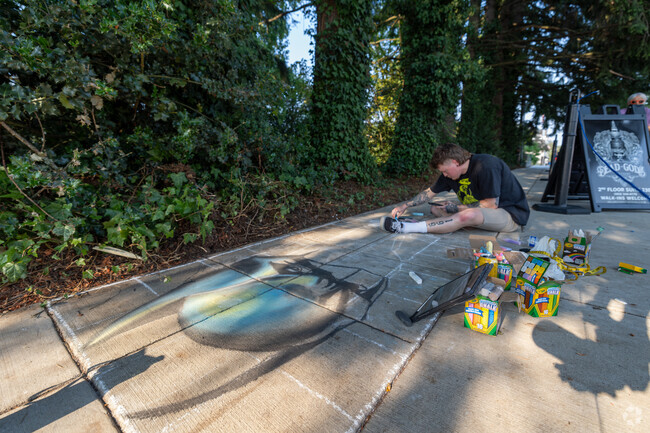 Local artist at work near Barrington Heights, adding character to the neighborhood.