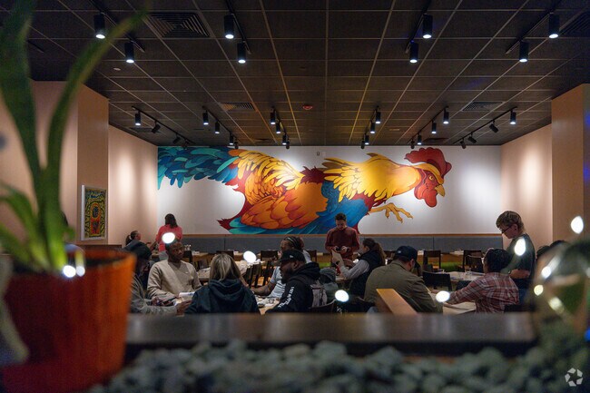 Enjoy flavorful bites and whiskey pairings in Neat Bird's trendy dining space.