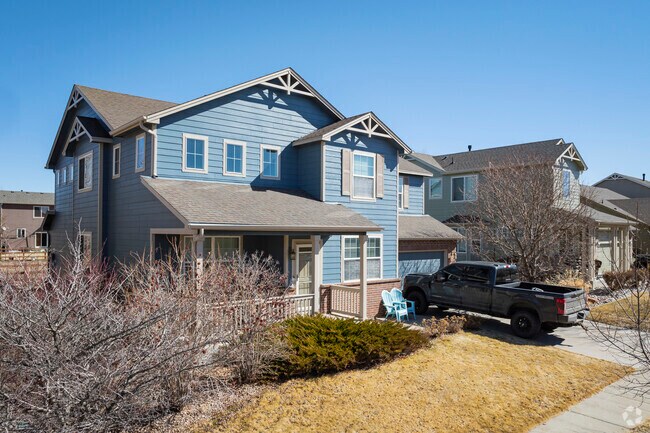 This pastel blue two-story in Hazeltine adds a pop of color to the neighborhood.