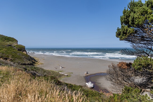 Locals can stroll the mocha-brown sand beaches here and admire the mountain views.