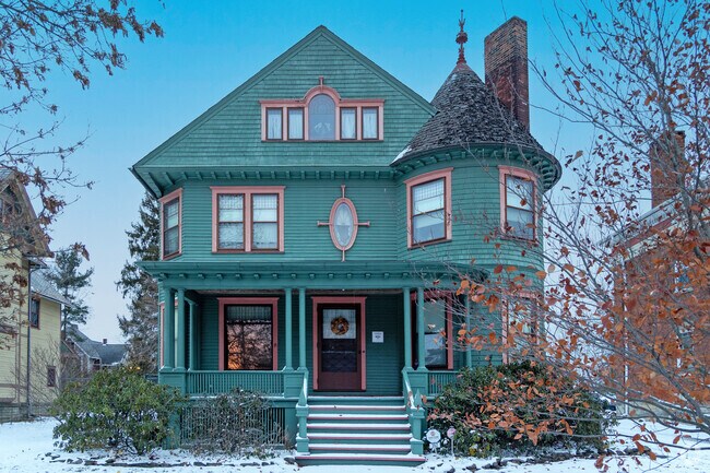 Stunning architecturally detailed Queen Anne Victorian home nestled in Historic Perkins.