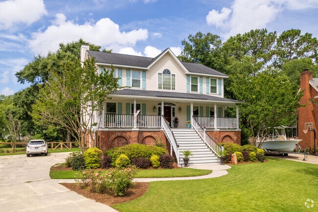 Southern craftsman homes are raised with large front porches in Hobcaw Plantation.