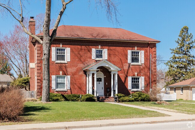 Colonial Revival home in Lords Park blends brick architecture with classic neighborhood charm.