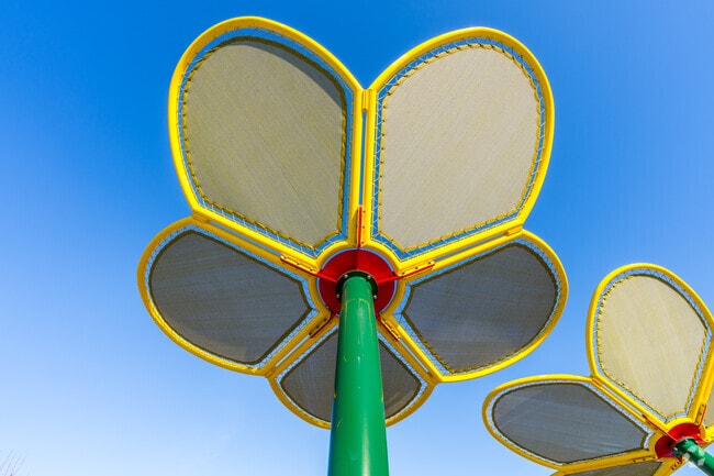 Heron Landing Park is decorated with tall flower shade structures.
