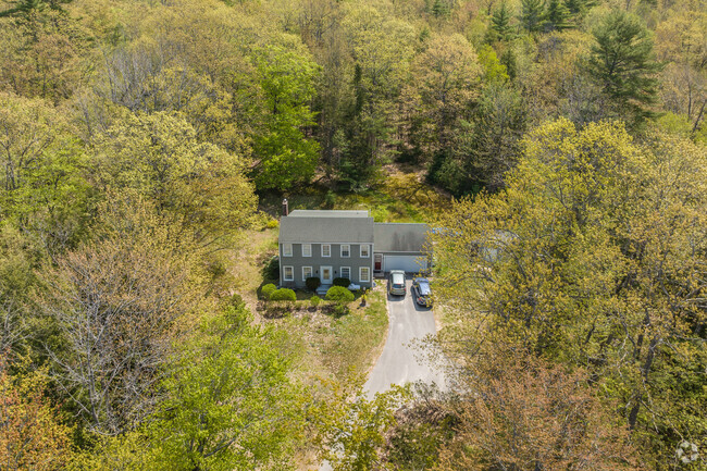 Aerial photo of a Colonial style home from the early 1970's in Casco, Maine.