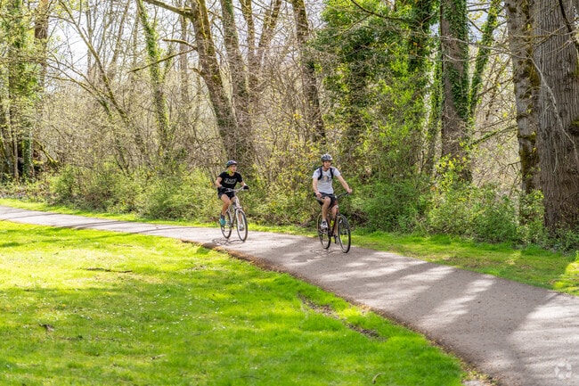 Cyclists enjoy the paved trails at Minto-Brown Island Park in South Central.