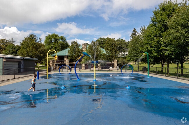 Kids can cool off at a Splash Park at Shedd Park near the Sacred Heart neighborhood in Lowell, MA