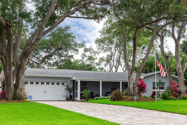 Del Oro Groves homes feature neatly manicured lawns and large shading trees.