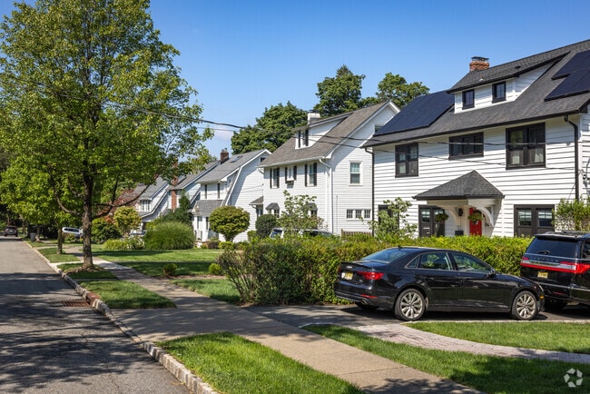 A row of homes in Verona showing lots filled with medium-large sized homes.