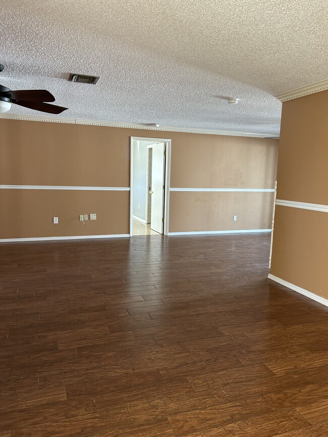 Living room and dining area at master bedroom entrance