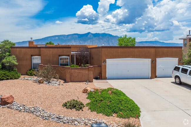 Pueblo style homes in River's Edge have flat roofs and stucco exteriors.