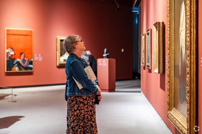 Visitors admire artwork at the Wichita Art Museum near Indian Hills.