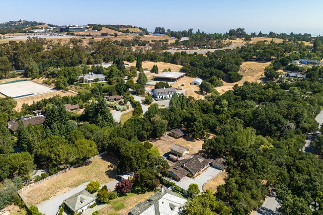 Up the winding hills of Woodside, CA you will find several acre lots.